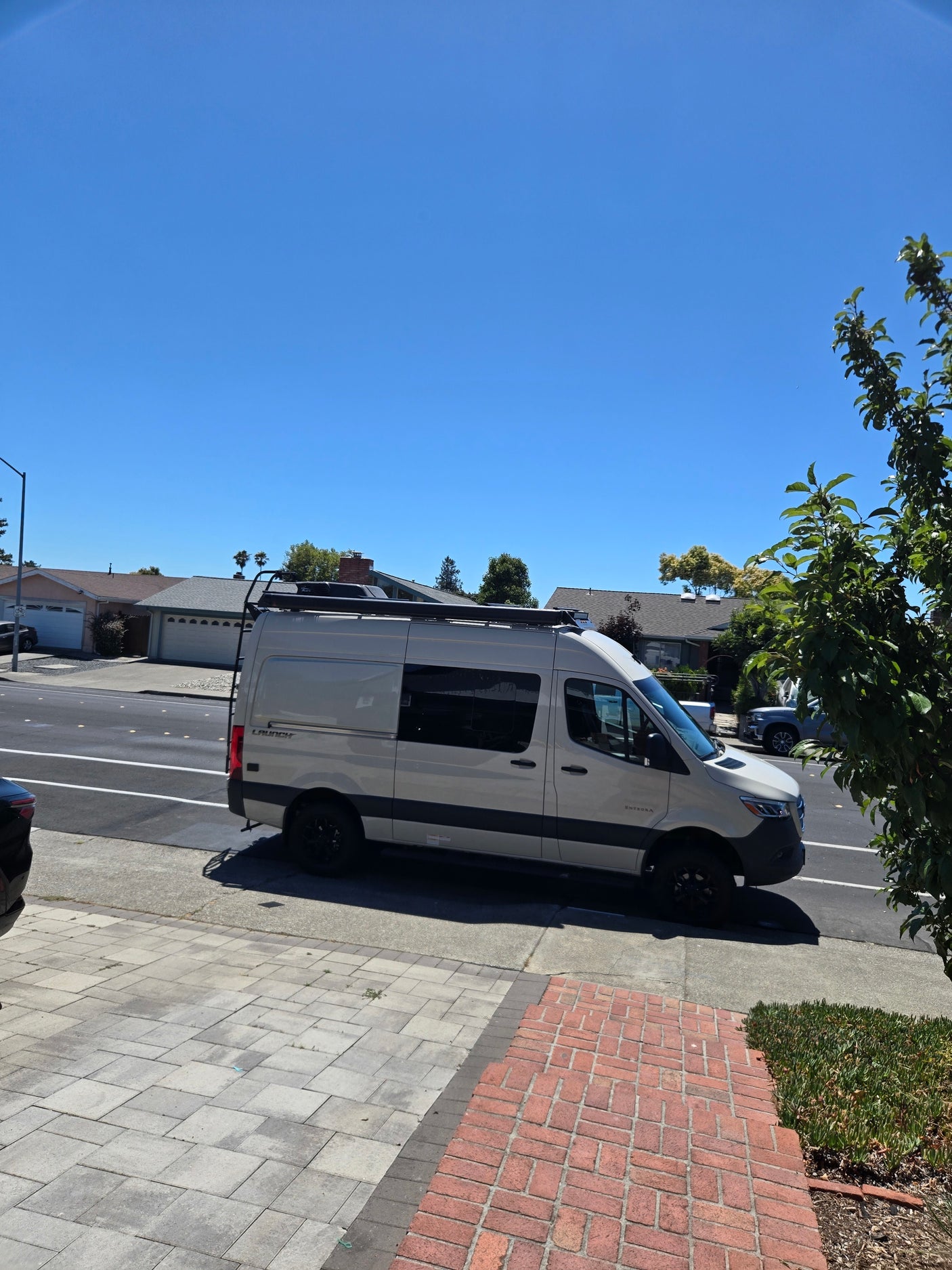 RV rental ready: A sleek Entegra Launch camper van parked on a sunny day, perfect for your next road trip adventure.