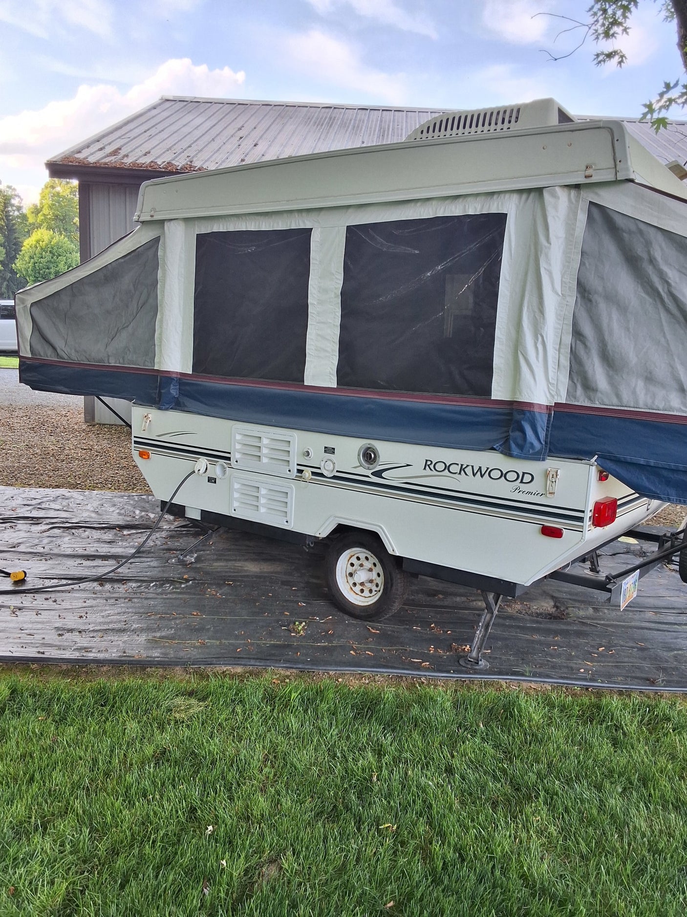 A Rockwood Premier pop-up camper, fully set up for RV rental. Perfect for your camping adventure and outdoor fun.