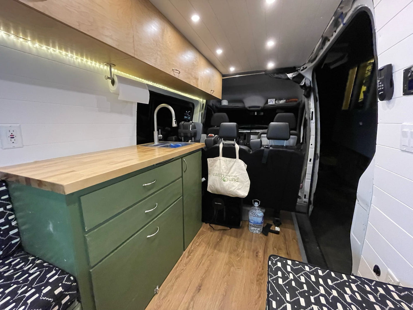 lit for easy access to camping essentials.|Spacious RV rental interior with custom kitchen