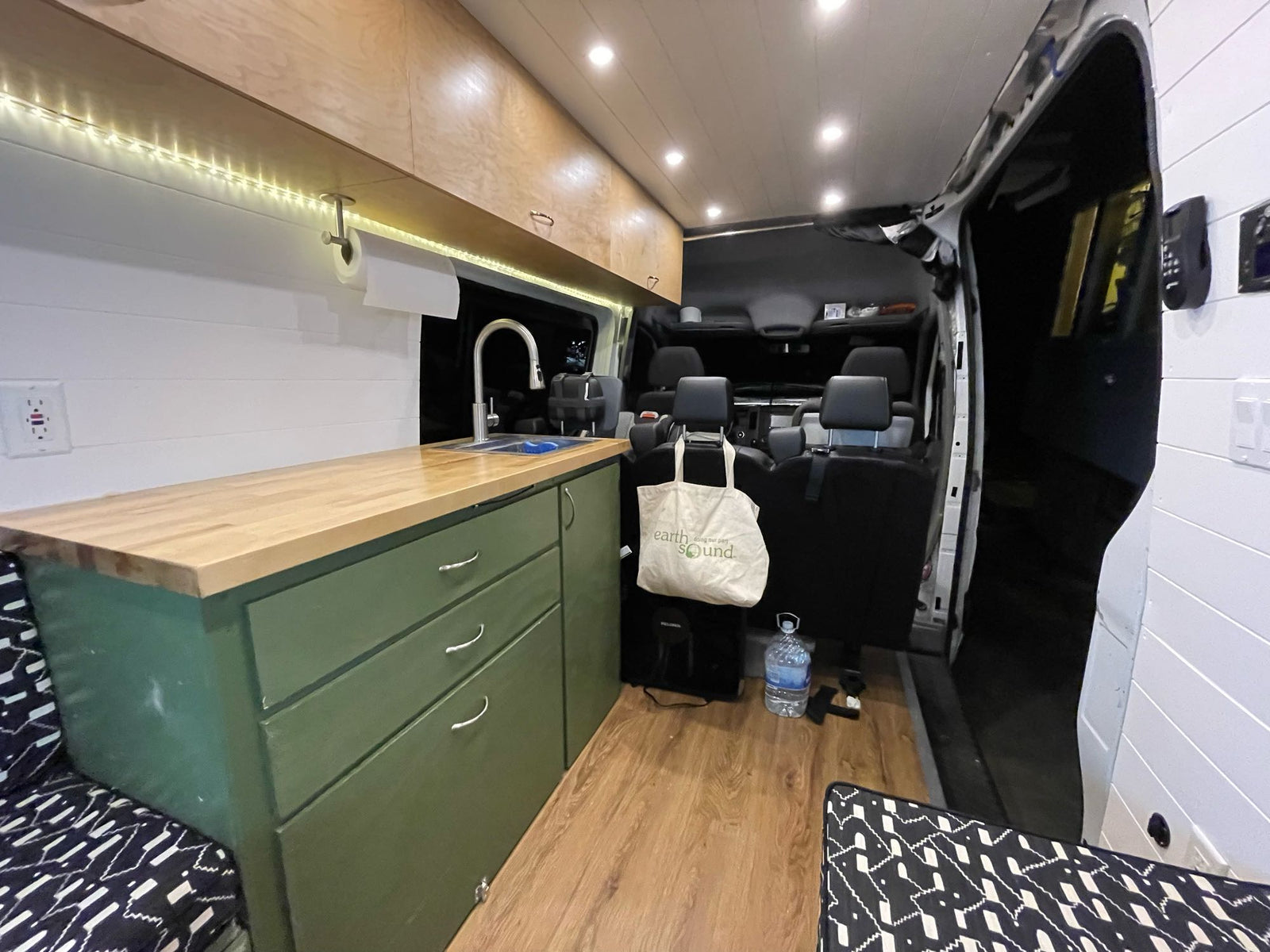 lit for easy access to camping essentials.|Spacious RV rental interior with custom kitchen