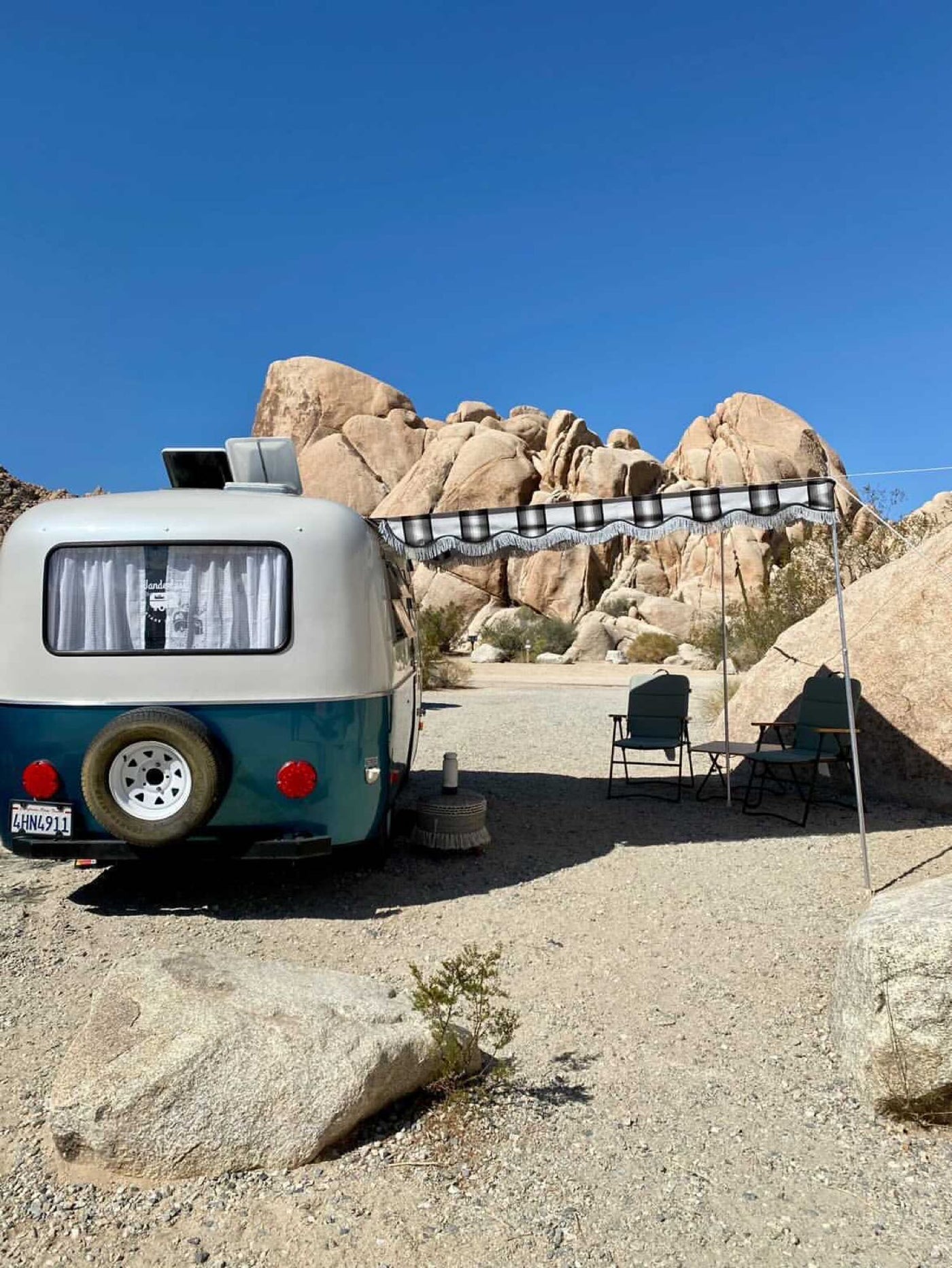 clean space.|Inviting RV rental interior showcasing a cozy bed with patterned blankets/pillows — photo 19