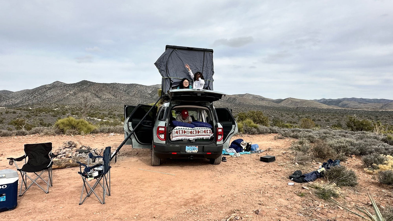 waters. Great comfort for road trips or any rv rental alternative.|Inside an RV rental car setup: rear seat holds a blue sleeping bag and pillow
