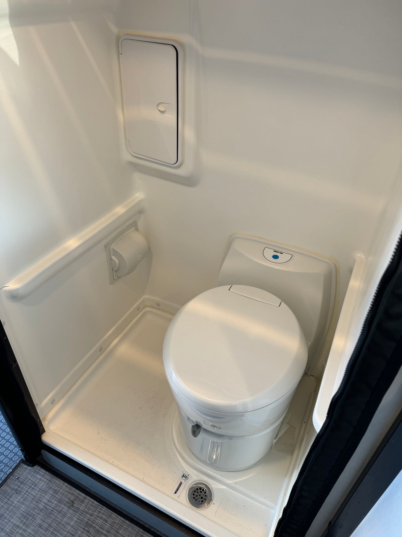 This RV rental features a clean, compact wet bath with a toilet and shower for your journey.