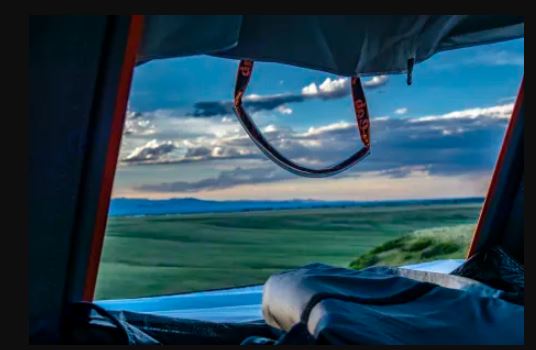 and the open road with mountains ahead.|The interior of an RV rental