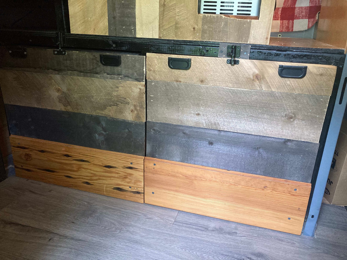 and rear windows.|White RV rental camper van parked