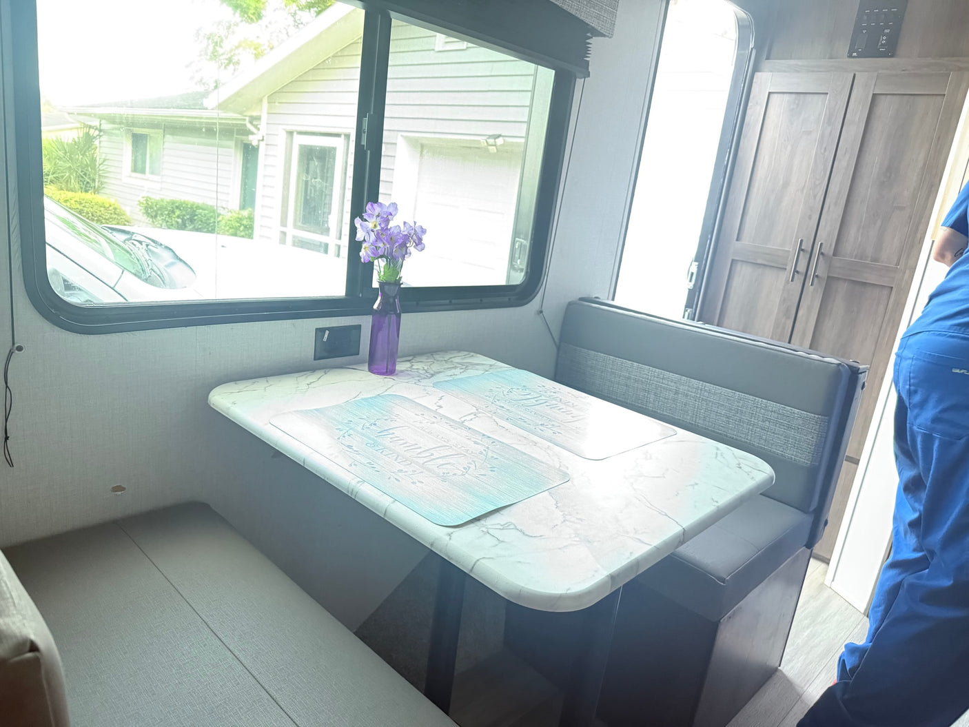 parked outdoors. Ideal for an rv rental.|Cozy RV rental bedroom featuring a bed with a unique comforter