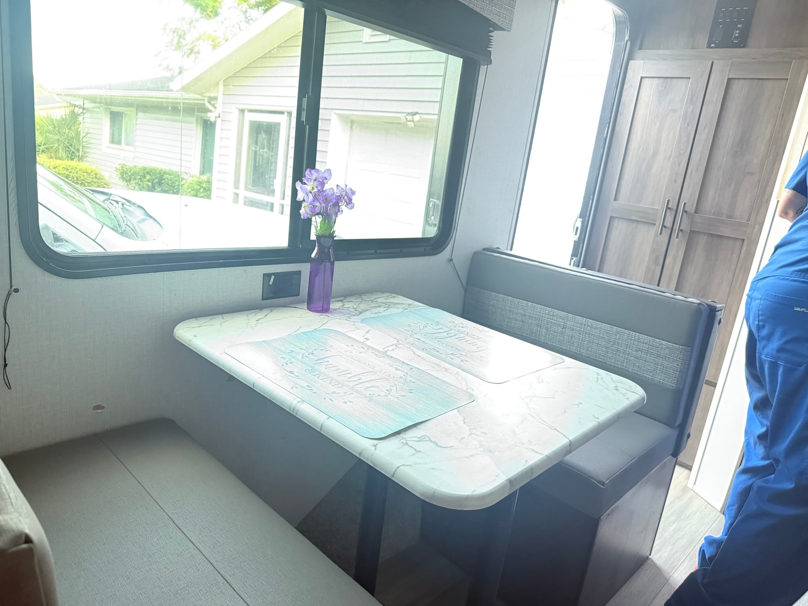 parked outdoors. Ideal for an rv rental.|Cozy RV rental bedroom featuring a bed with a unique comforter