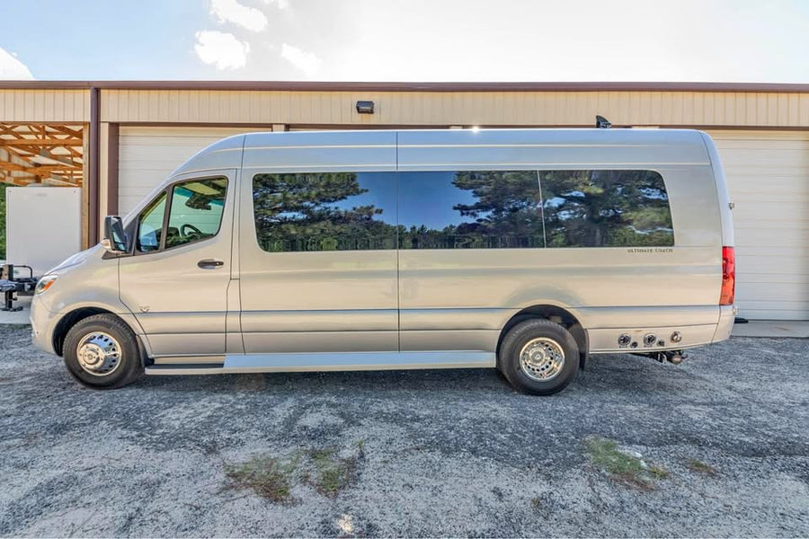 and stylish dark wood trim.|Luxury rv rental interior showcasing plush cream seats