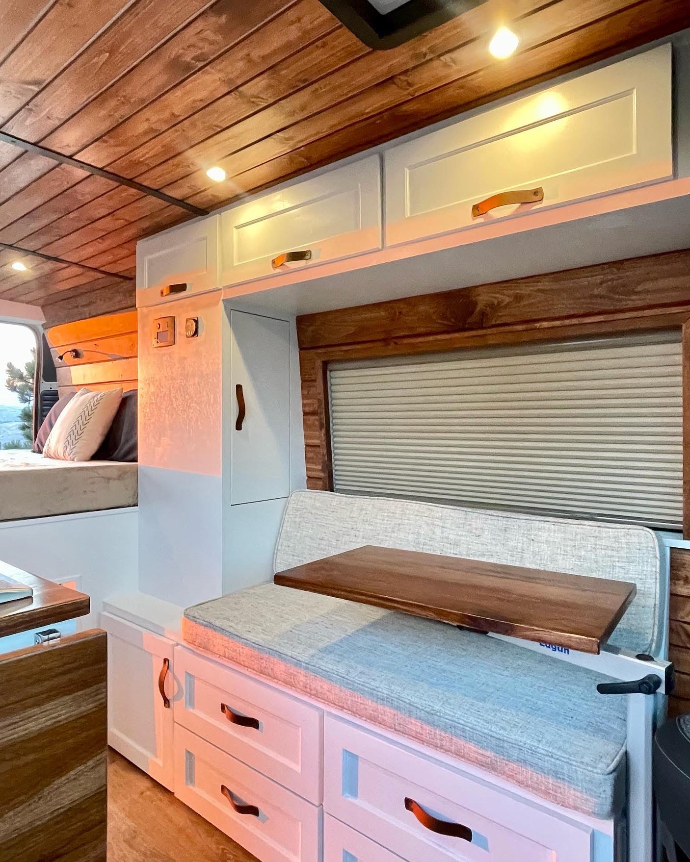 Cozy RV rental interior with wooden ceiling