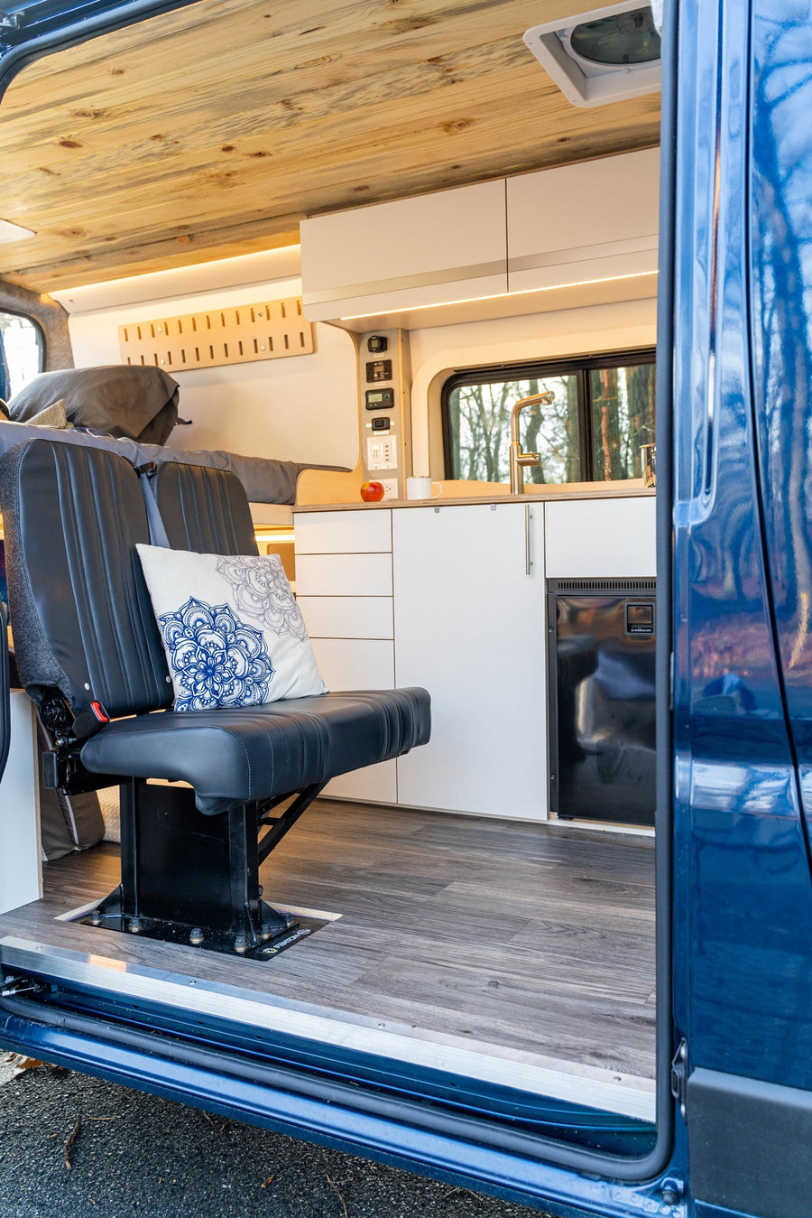and seating for an RV rental adventure. Compact living.|Modular RV rental interior kit: an elevated bed