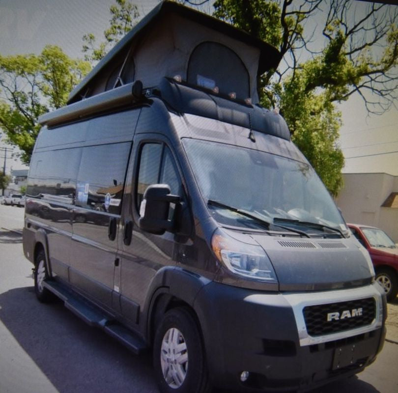 This dark grey Ram ProMaster pop-top camper van is ready for your next RV rental adventure.