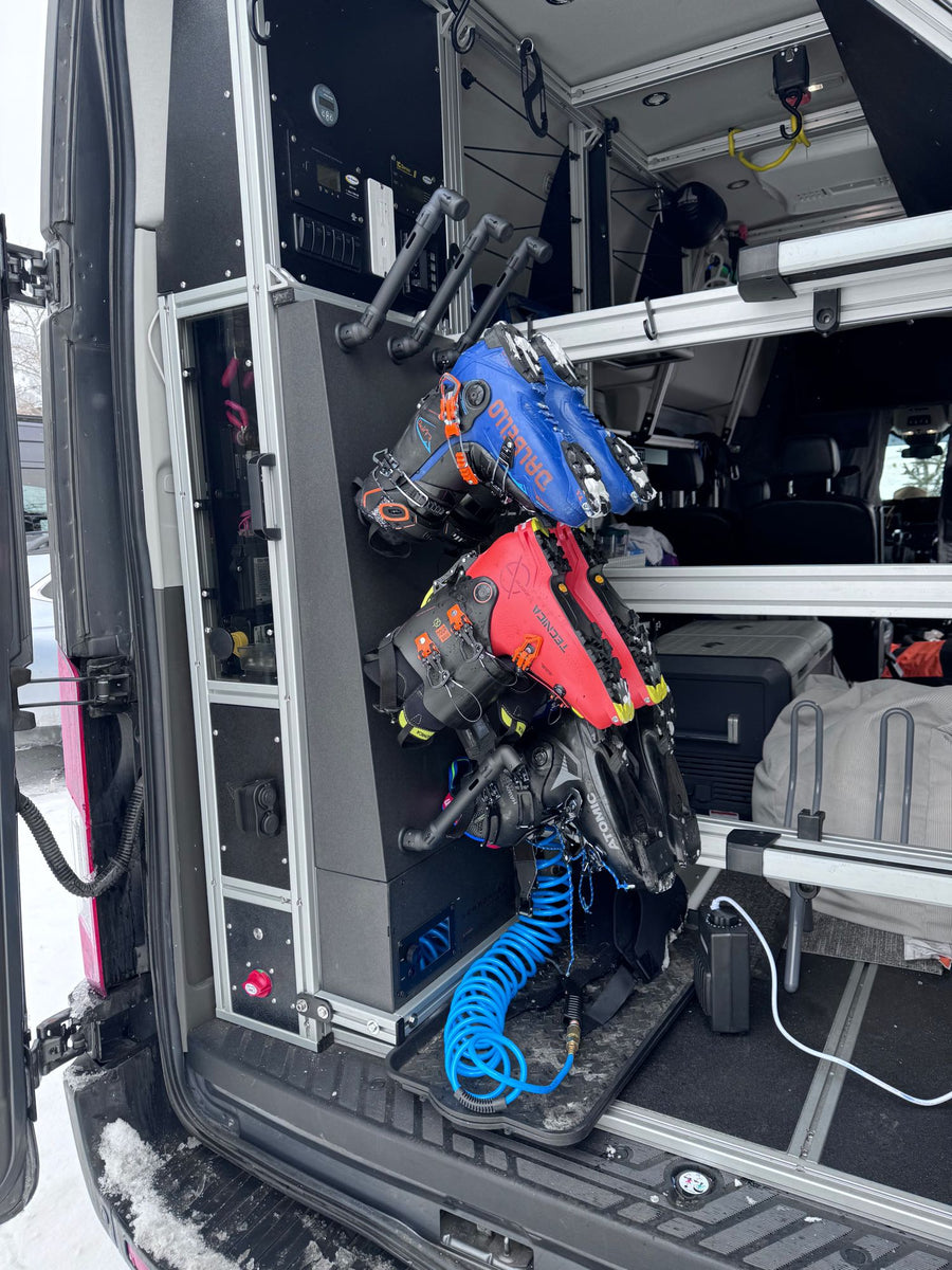 in a workshop.|An RV rental camper van's custom rear storage