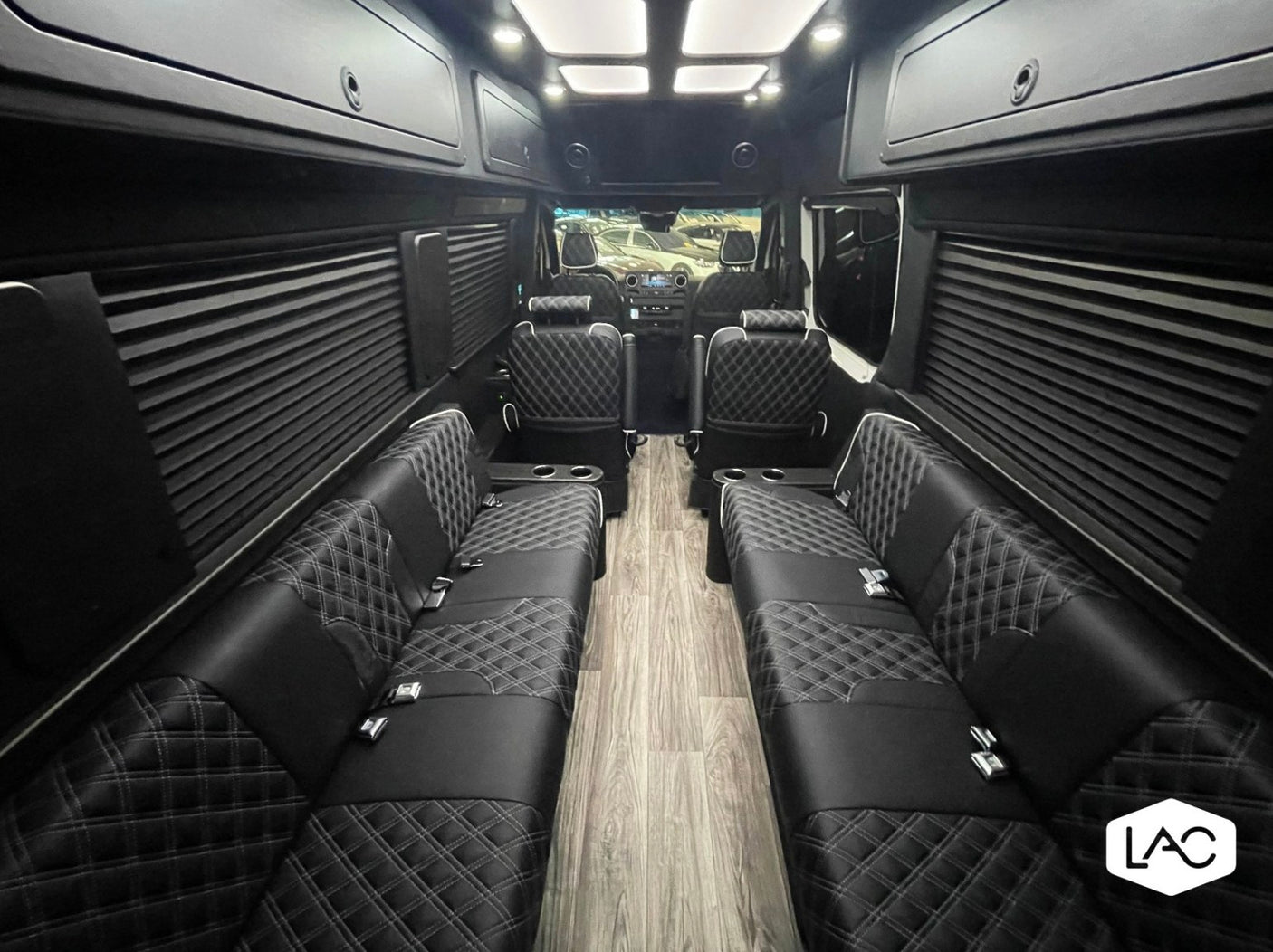 and captain chairs.|Experience premium comfort! This luxury RV rental interior features diamond-stitched seats