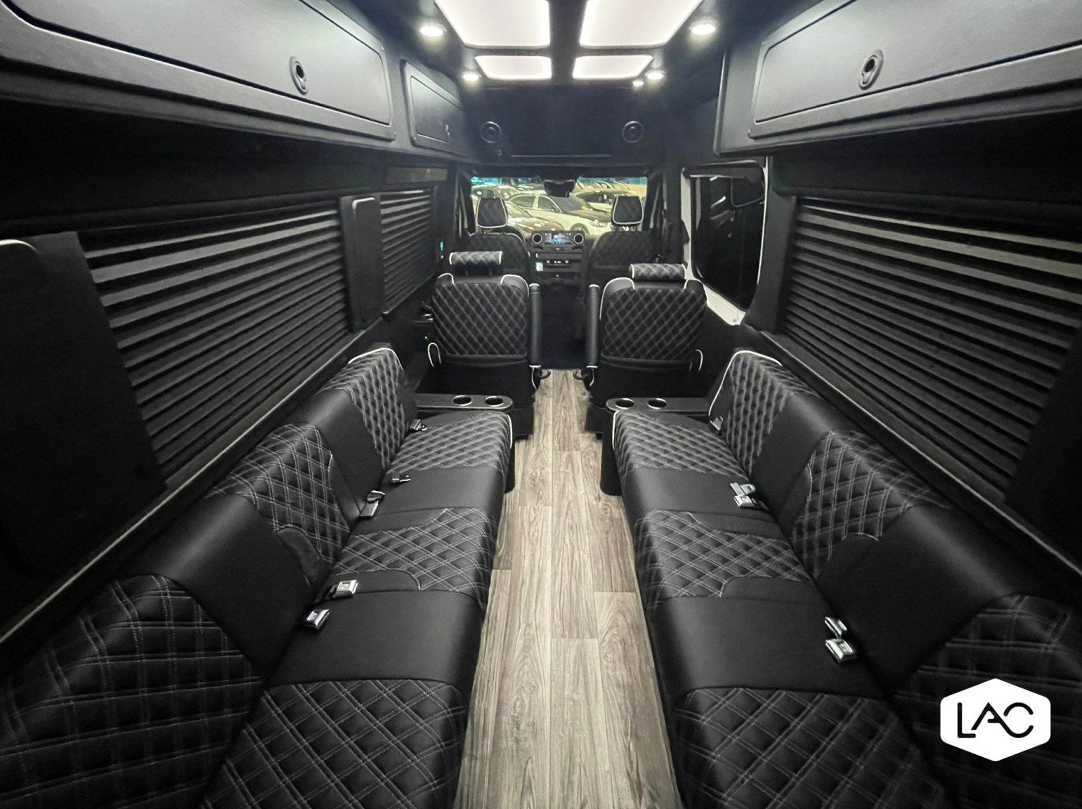 and captain chairs.|Experience premium comfort! This luxury RV rental interior features diamond-stitched seats