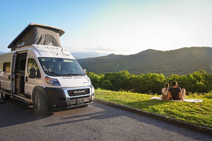 enjoying the outdoors.|This RV rental's interior features a compact kitchen with sink