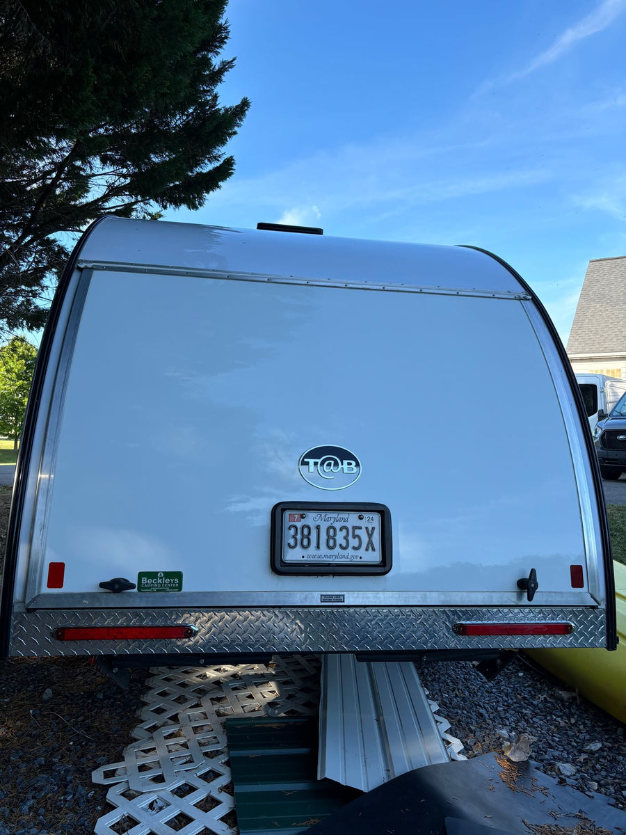 and a table disassembled for travel.|This RV rental wet bath offers a compact toilet