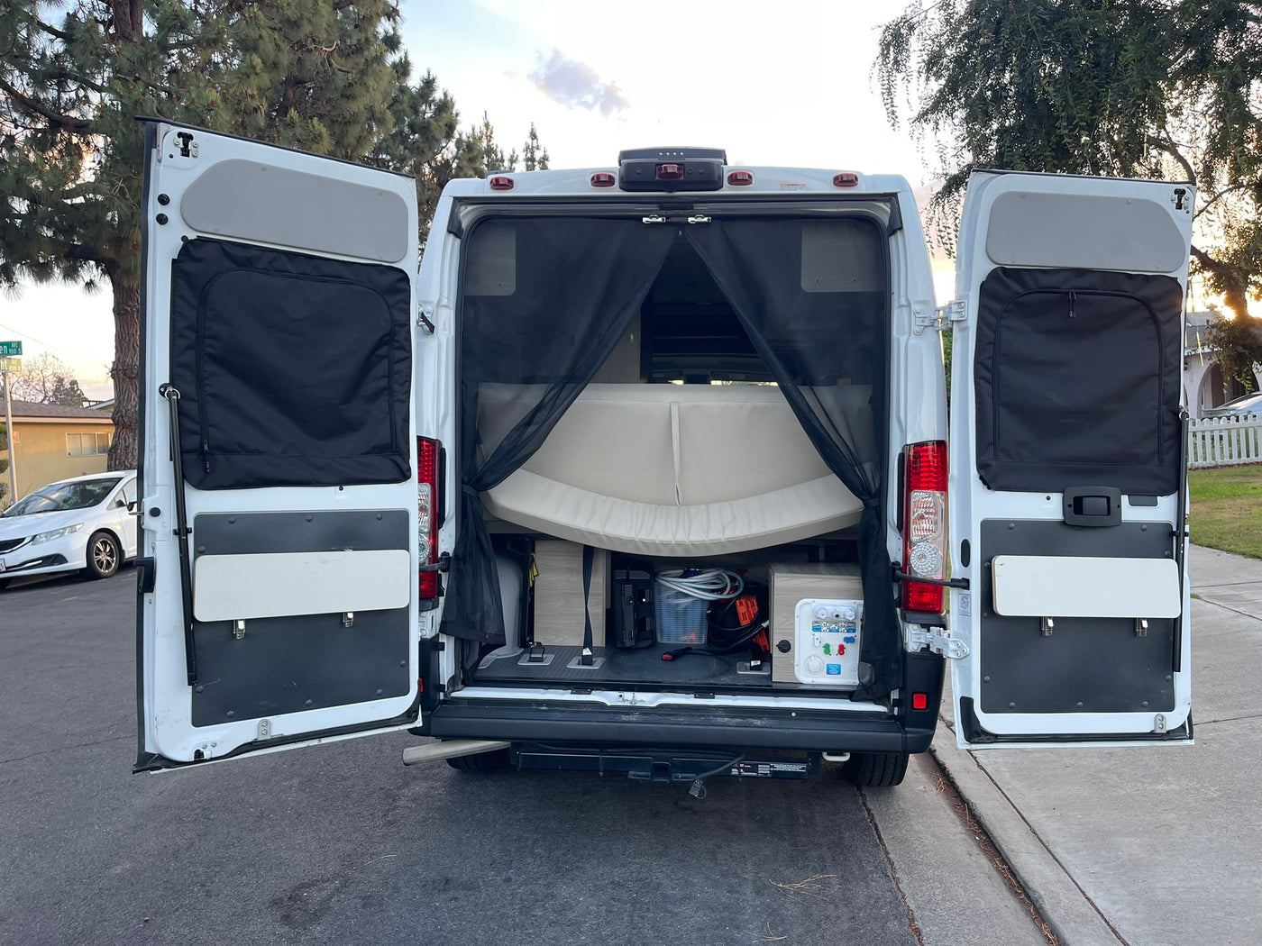 perfect for your next rv rental.|This RV rental showcases its open rear doors — photo 12