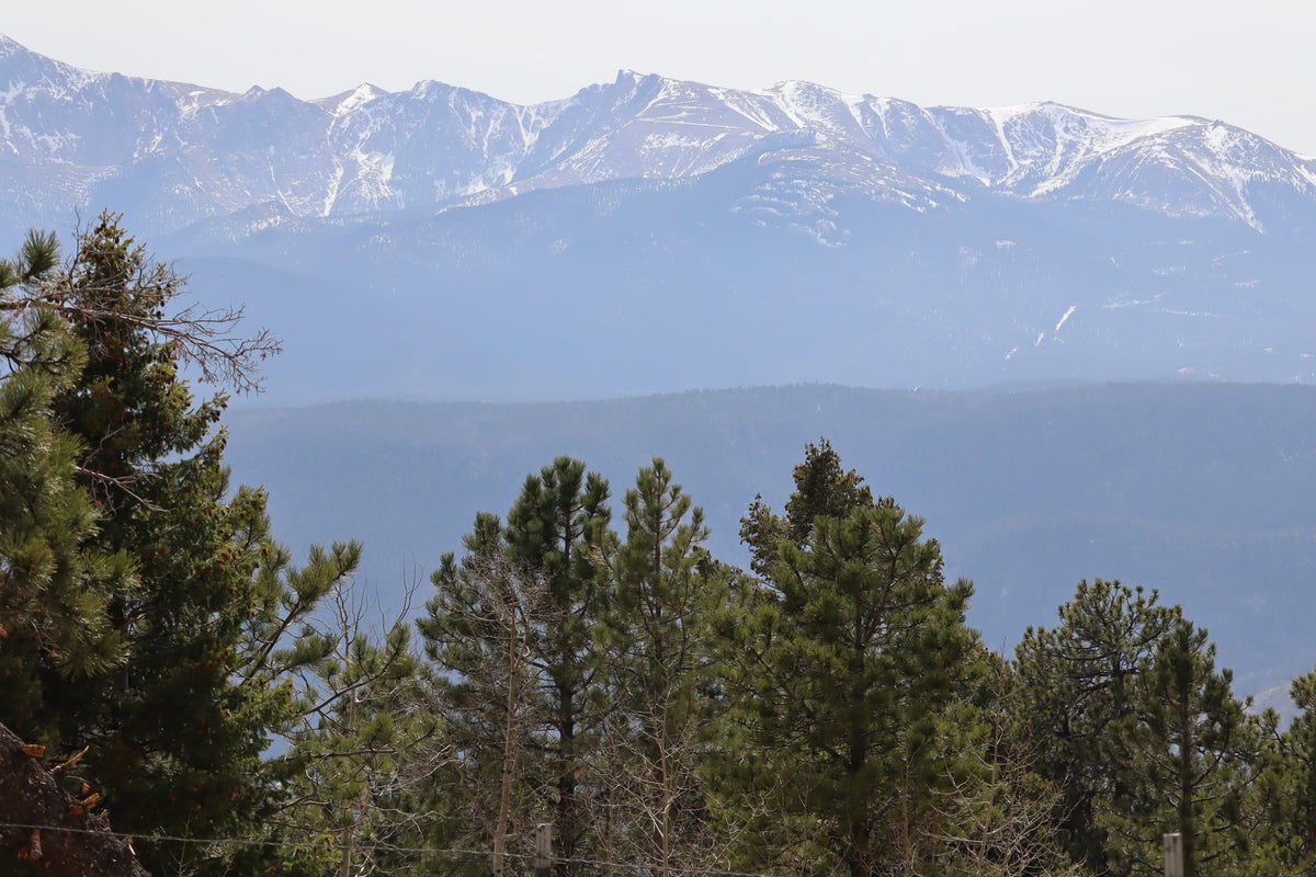 RV rental adventure: Snow-capped mountains rise above lush pine forests, offering a breathtaking scenic getaway. — photo 17