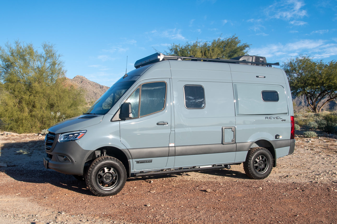 Light gray Winnebago Revel Sprinter van for your next rv rental. An overland camper ideal for desert travel & adventure.