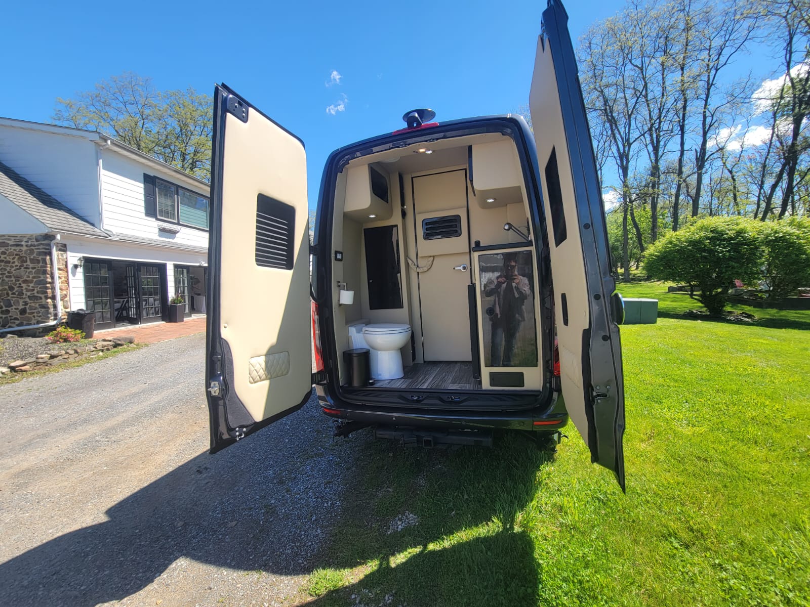 and stylish wood flooring.|Inside this premium RV rental: comfortable cream seating