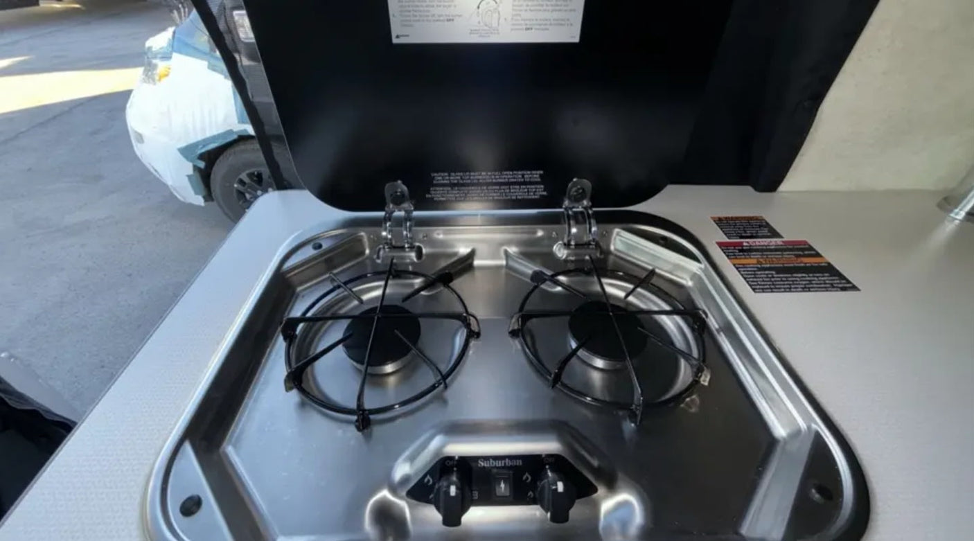 showing top and rear views of the RV lot for safe maneuvering.|RV rental control panel: Truma thermostat
