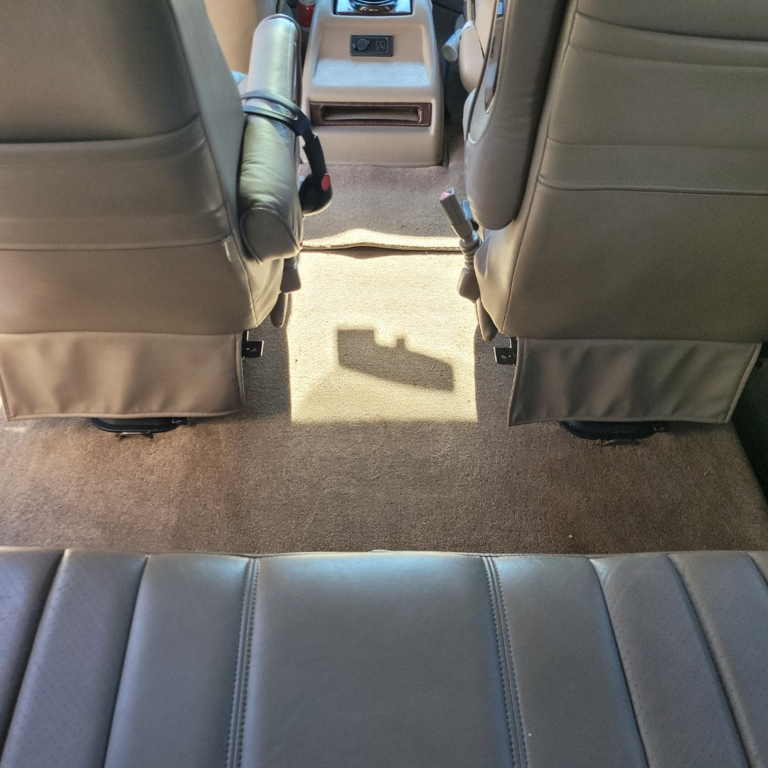 and handy mesh storage.|Spacious RV rental interior with plush leather seats