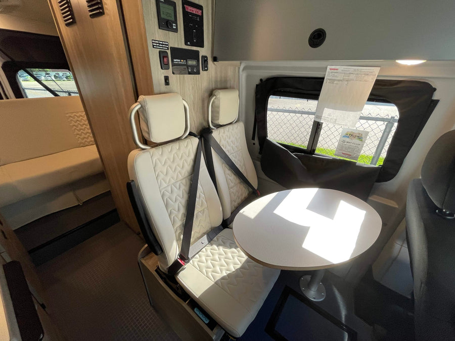is in the background.|Front cabin interior of an RV rental