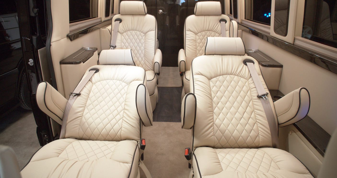 and extending footrests.|Inside a premium RV rental: spacious cabin with luxurious cream-colored