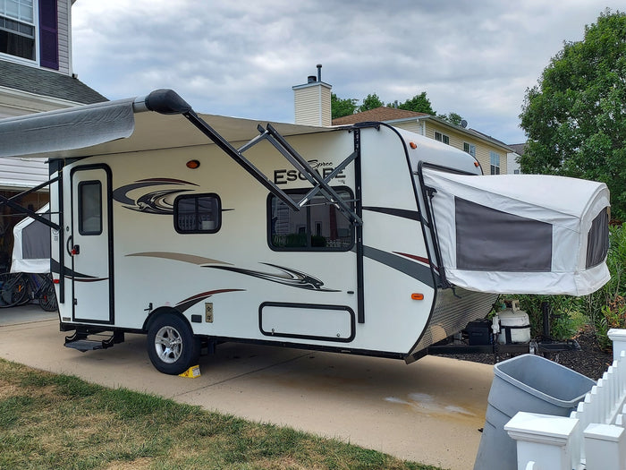 parked on a driveway|A bright white RV rental
