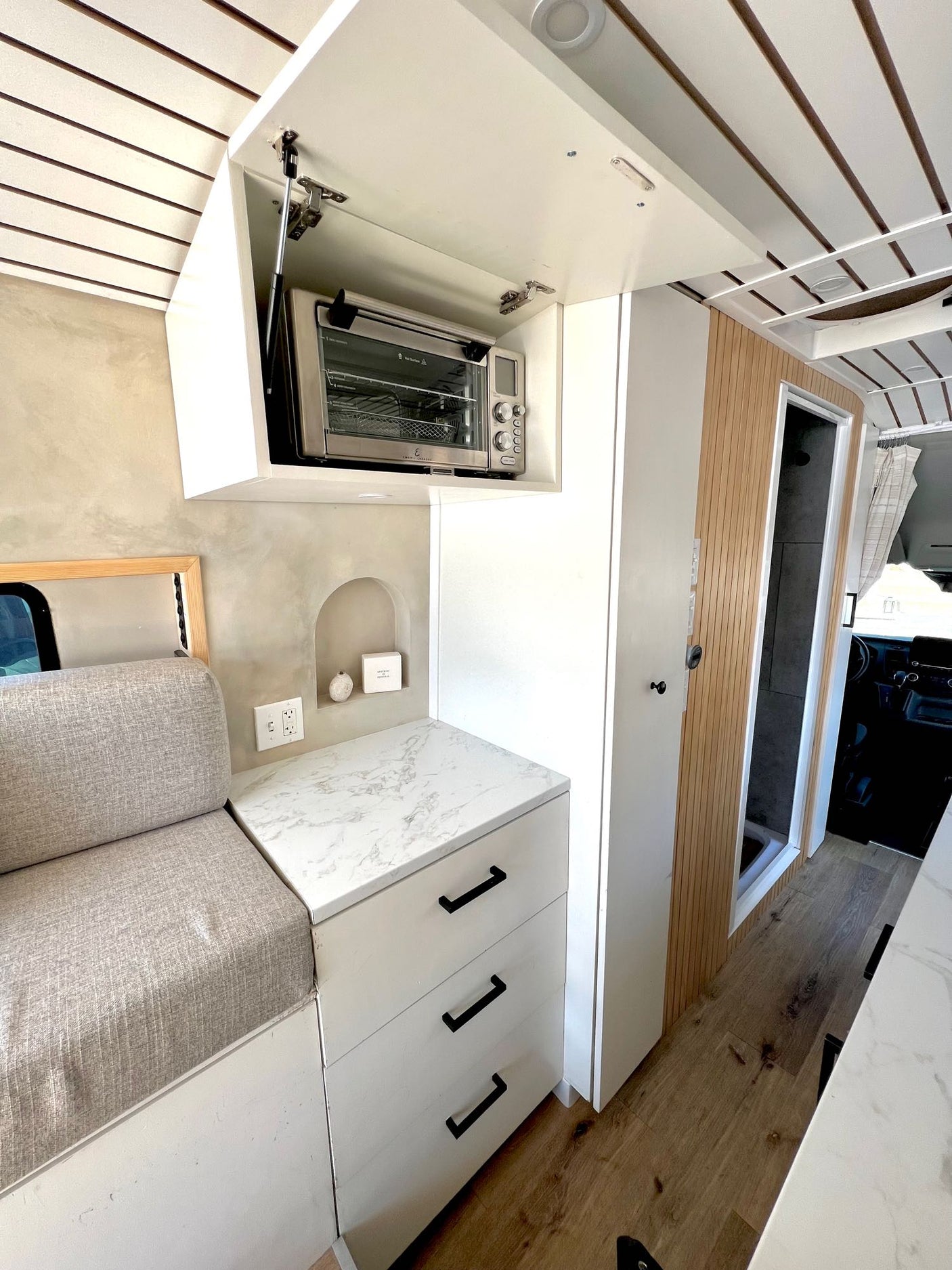 and USB ports.|Spacious front cabin of an RV rental