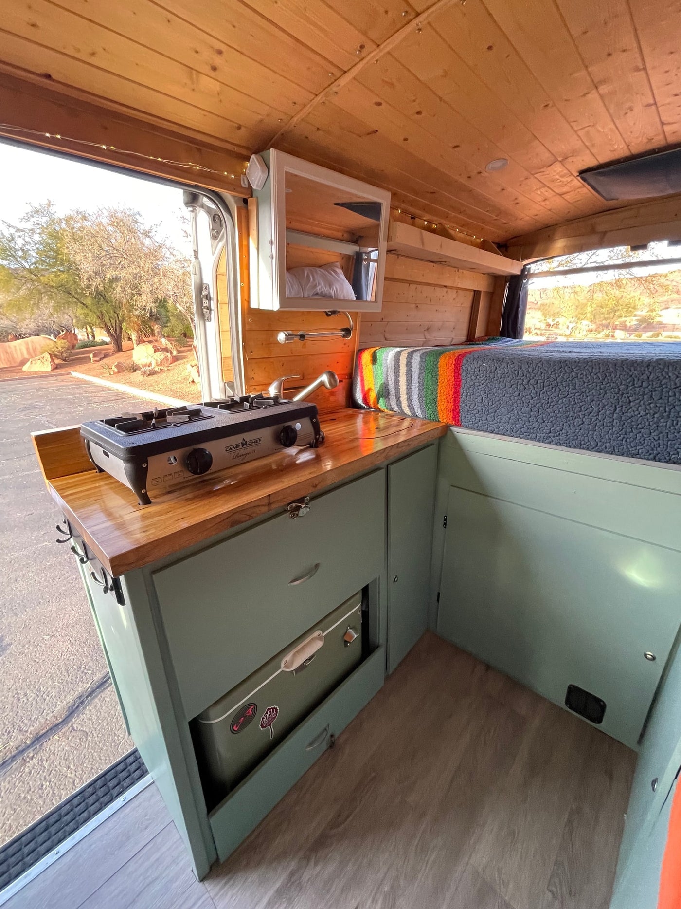 and stunning desert landscape outside.|Inside a charming rv rental campervan — photo 6