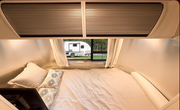 wooded campsite.|This shiny Airstream RV rental is perfect for a cozy camping adventure