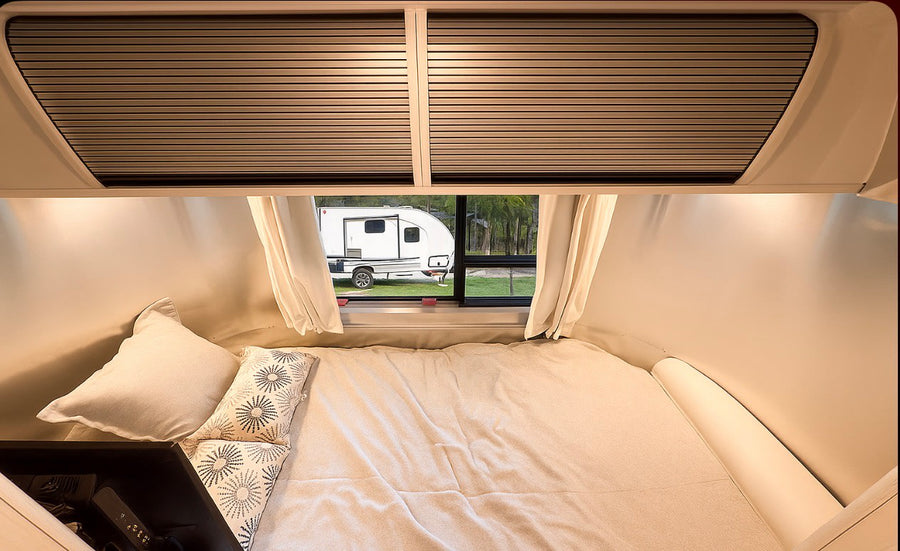 wooded campsite.|This shiny Airstream RV rental is perfect for a cozy camping adventure