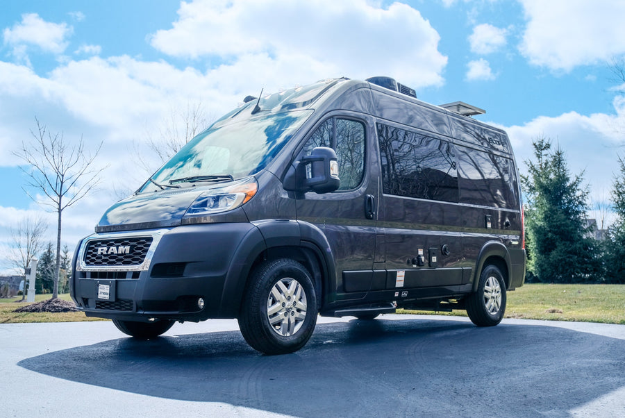 Explore freedom with this dark grey Ram ProMaster Class B camper van, perfect for your next RV rental adventure.