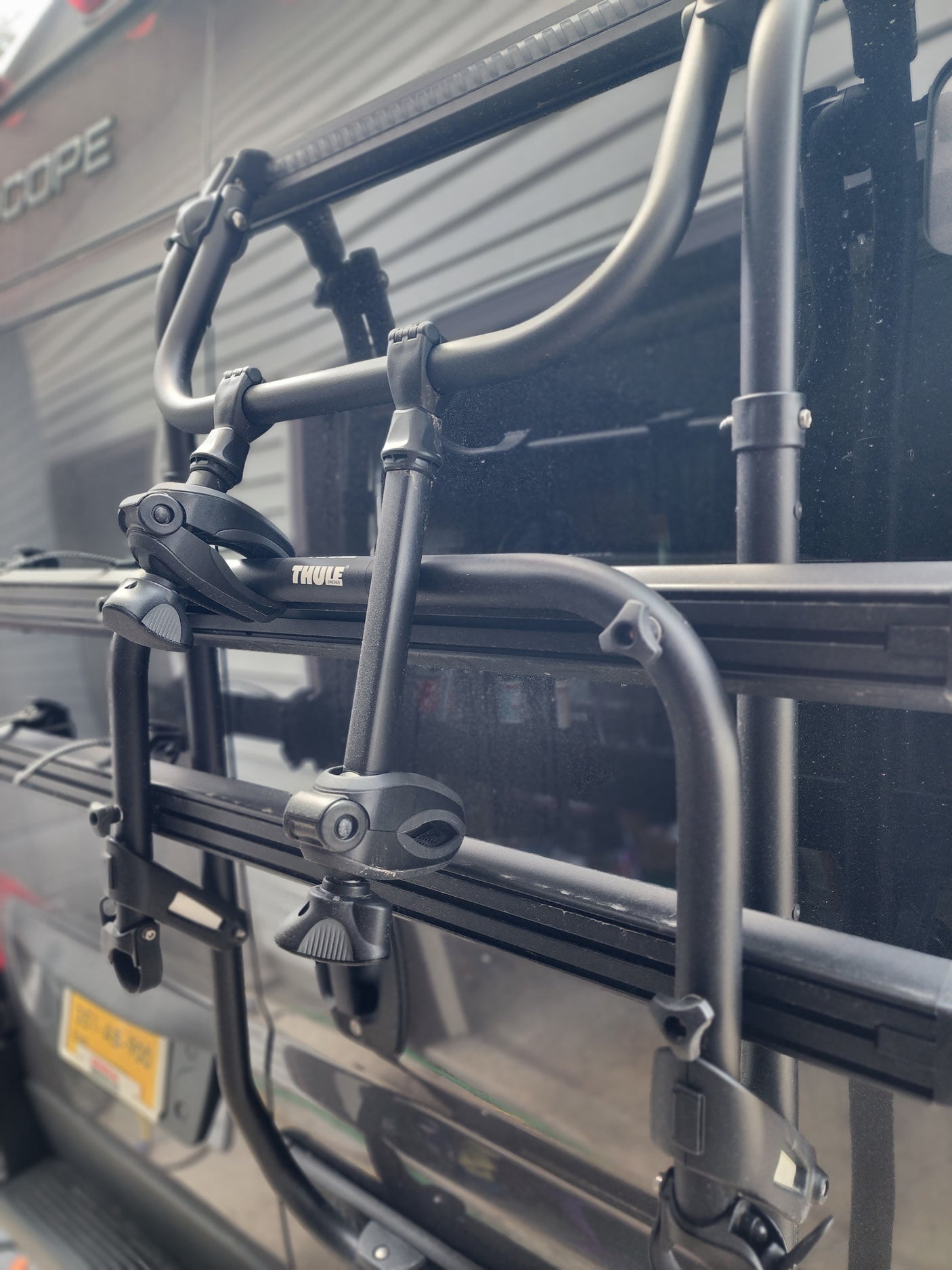 A Thule bike rack, designed for an RV rental, securely mounted on the vehicle's rear. Ready for outdoor excursions.