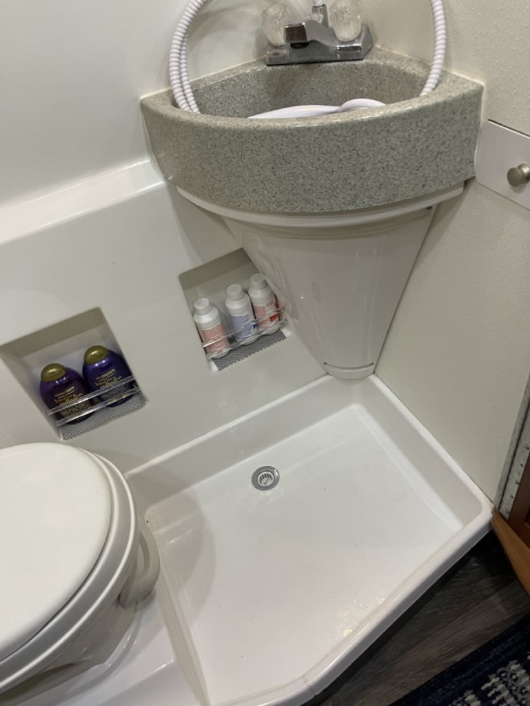 ideal for road trips.|RV rental kitchen: wooden cabinets with frosted glass