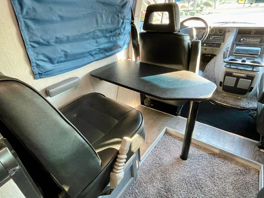 and a small table.|Spacious RV rental interior: comfortable seating