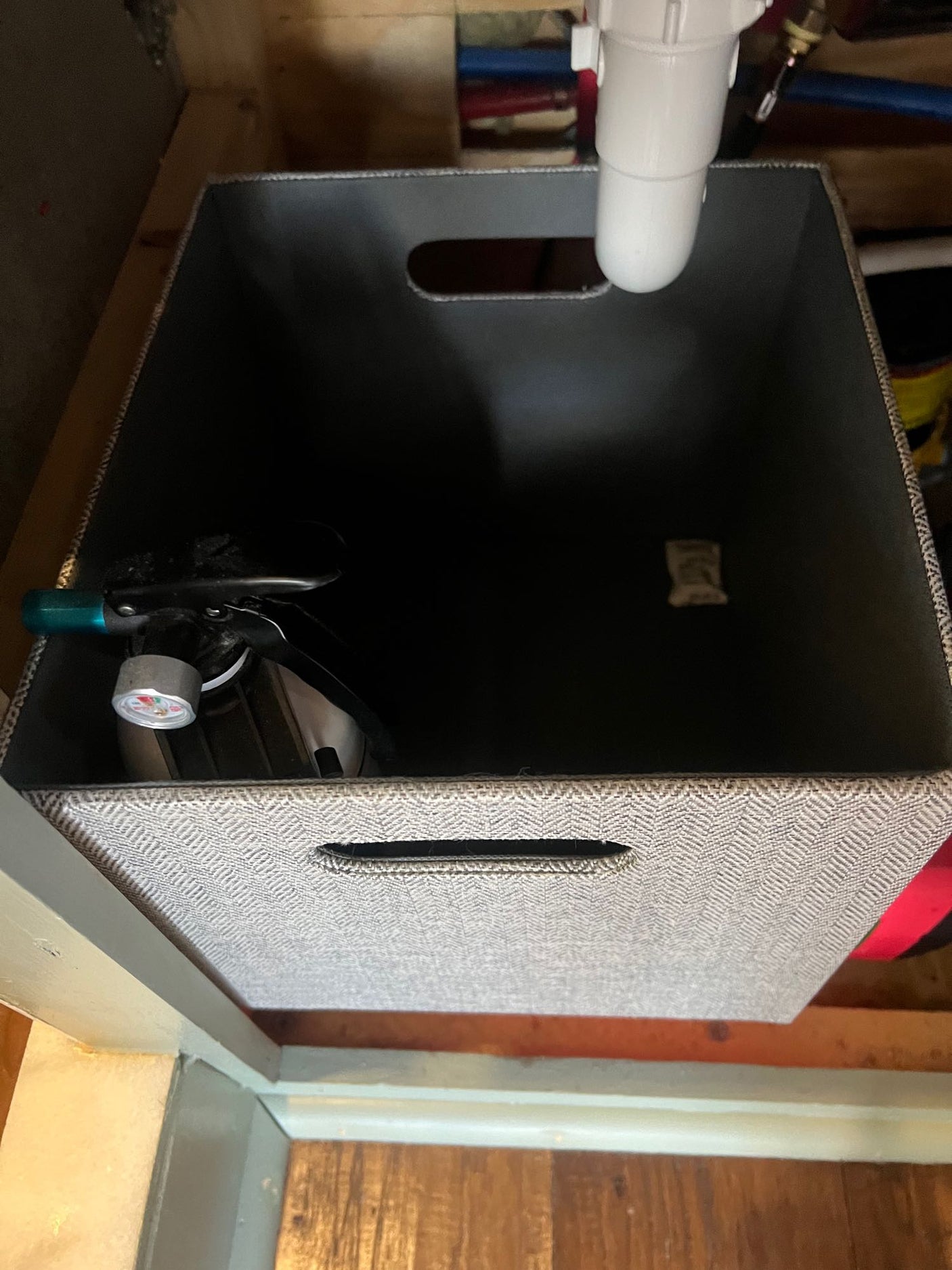 & a corkscrew neatly stored.|RV rental kitchen drawer neatly organized with cooking utensils like a rolling pin