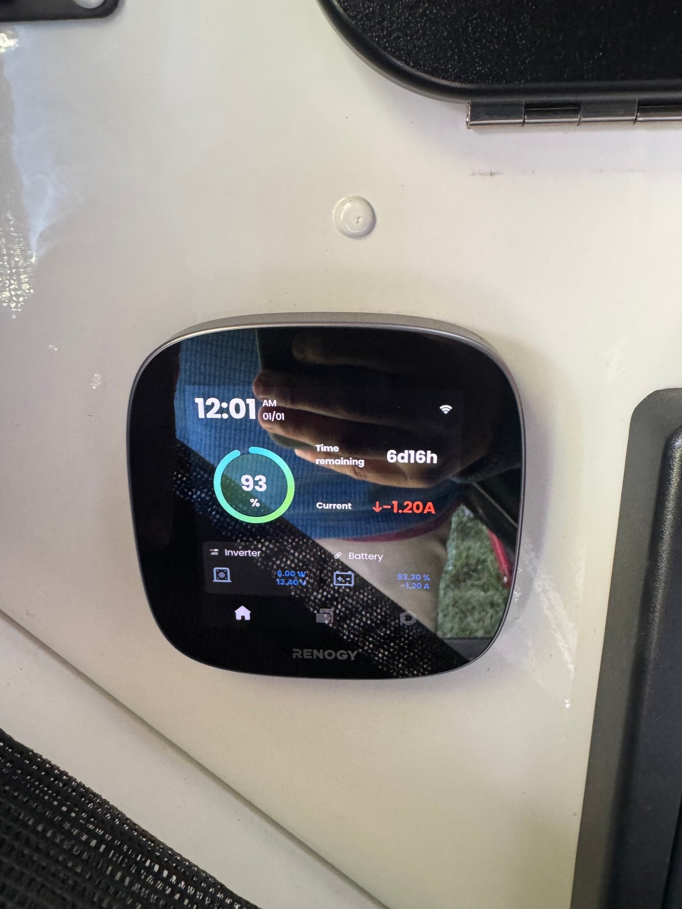 Renogy power monitoring display in an rv rental shows 93% battery charge, 6d16h remaining, and -1.20A current.