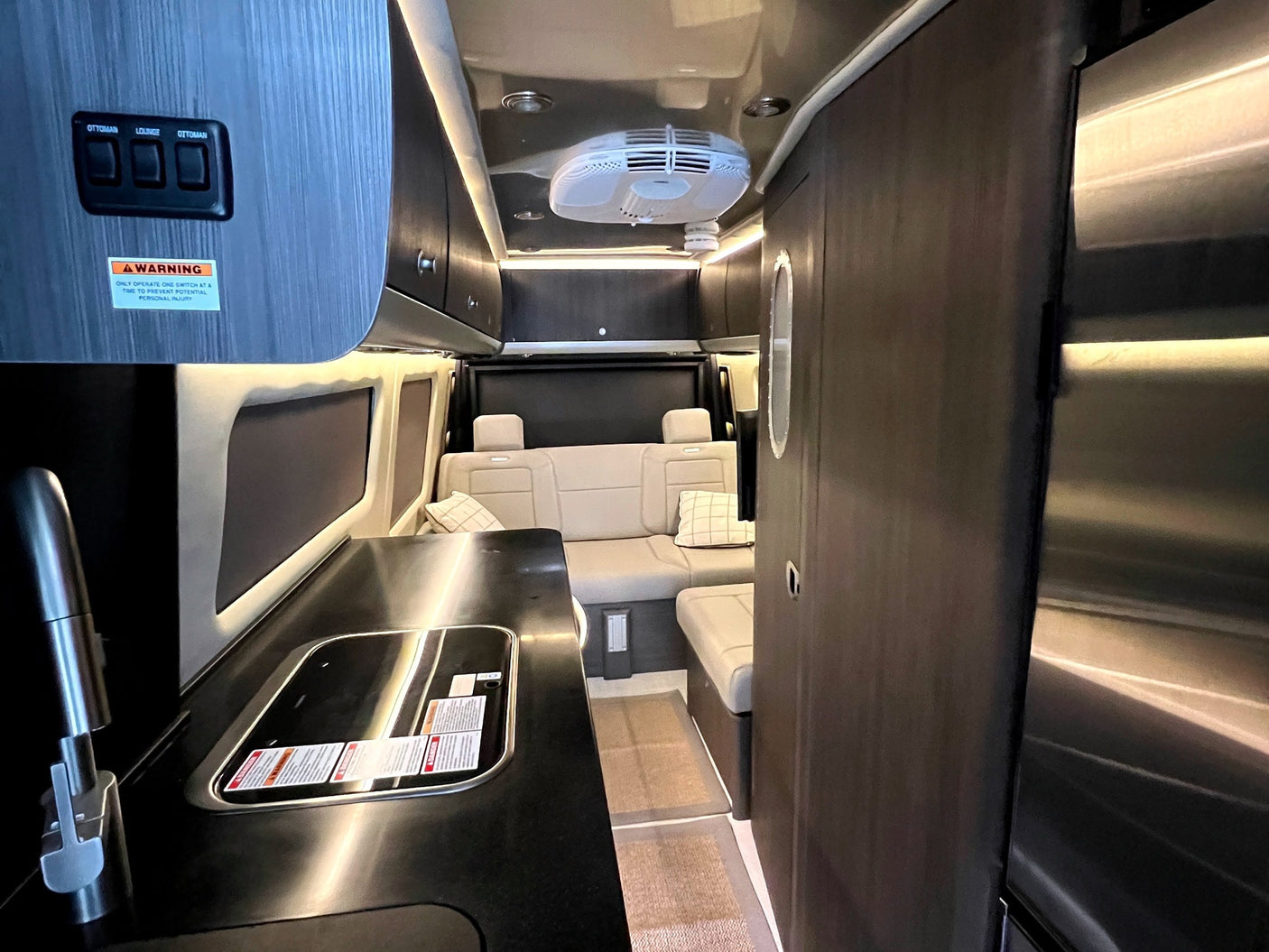 and serene window views. Your next adventure awaits!|Spacious RV rental interior features a large