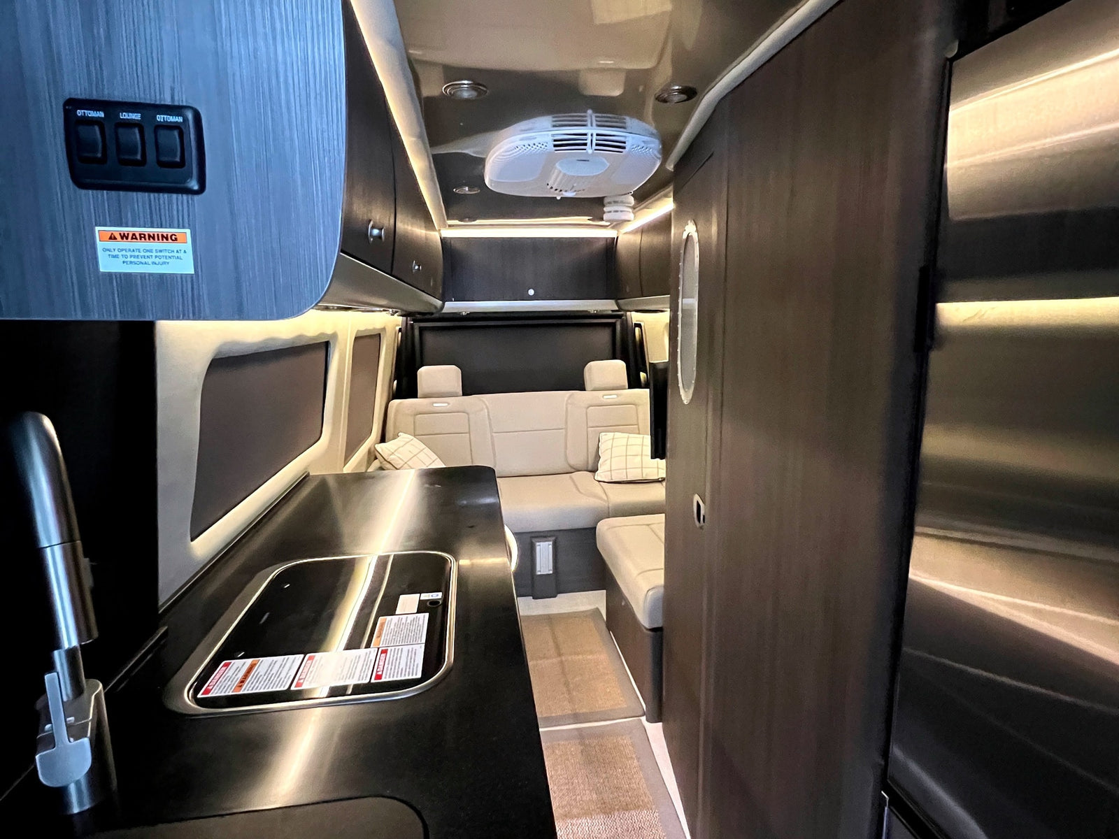 and serene window views. Your next adventure awaits!|Spacious RV rental interior features a large