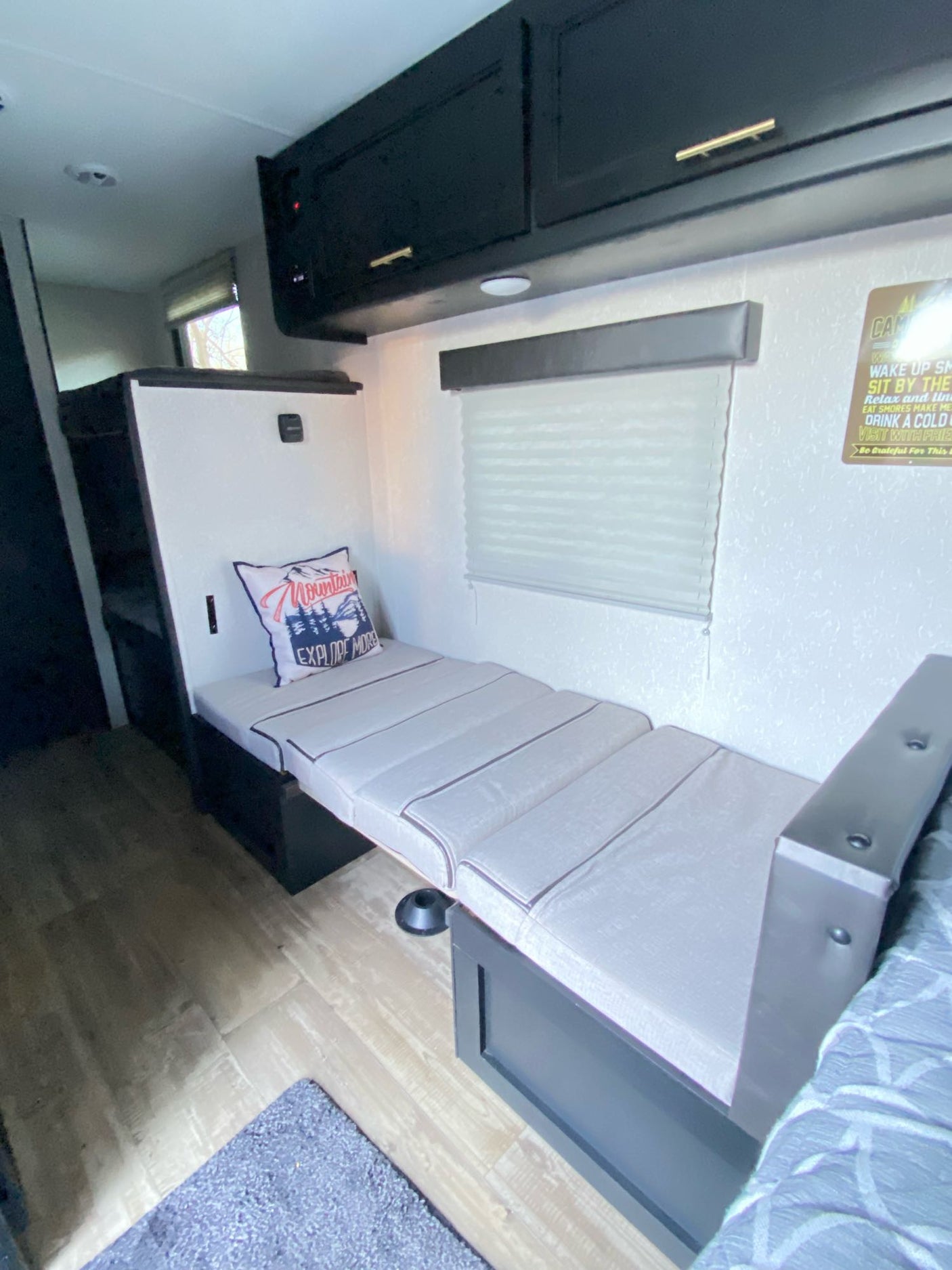 and shower curtain. Essential for travel.|View of a compact RV rental bathroom