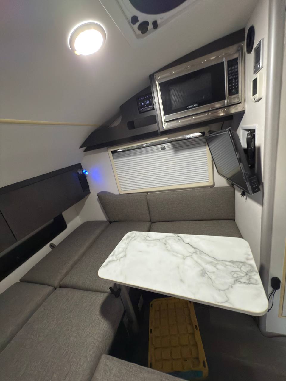 parked on grass. Ready for adventure!|This white Boondock teardrop RV rental