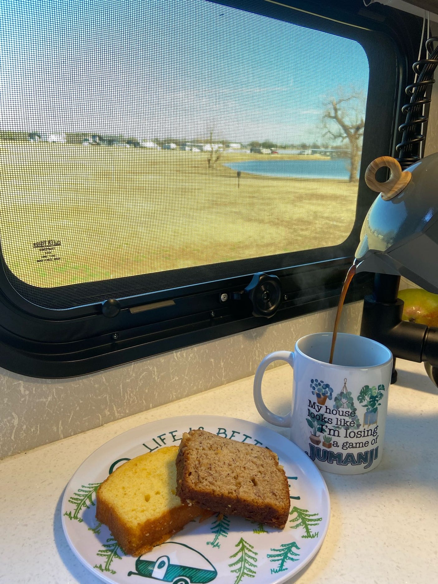 and essential appliances for travel comfort.|Comfortable RV rental interior showcasing a cozy bed
