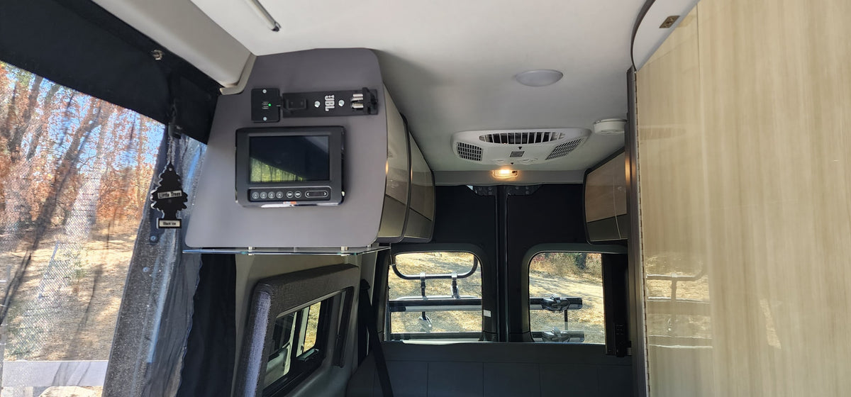 Clean rv rental interior featuring a control panel, AC unit, USB charging, and rear view windows. — photo 8