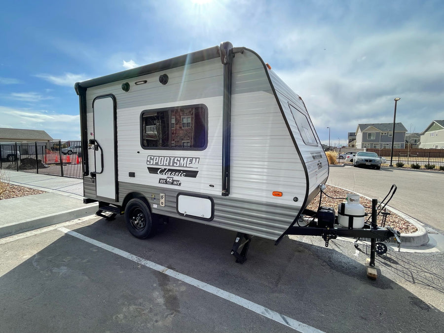 Explore the outdoors! This light gray Sportsmen Classic travel trailer