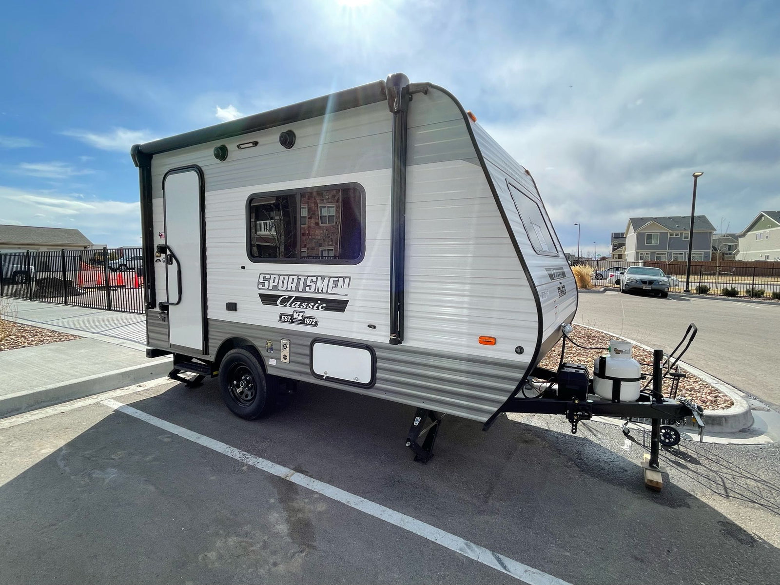 Explore the outdoors! This light gray Sportsmen Classic travel trailer