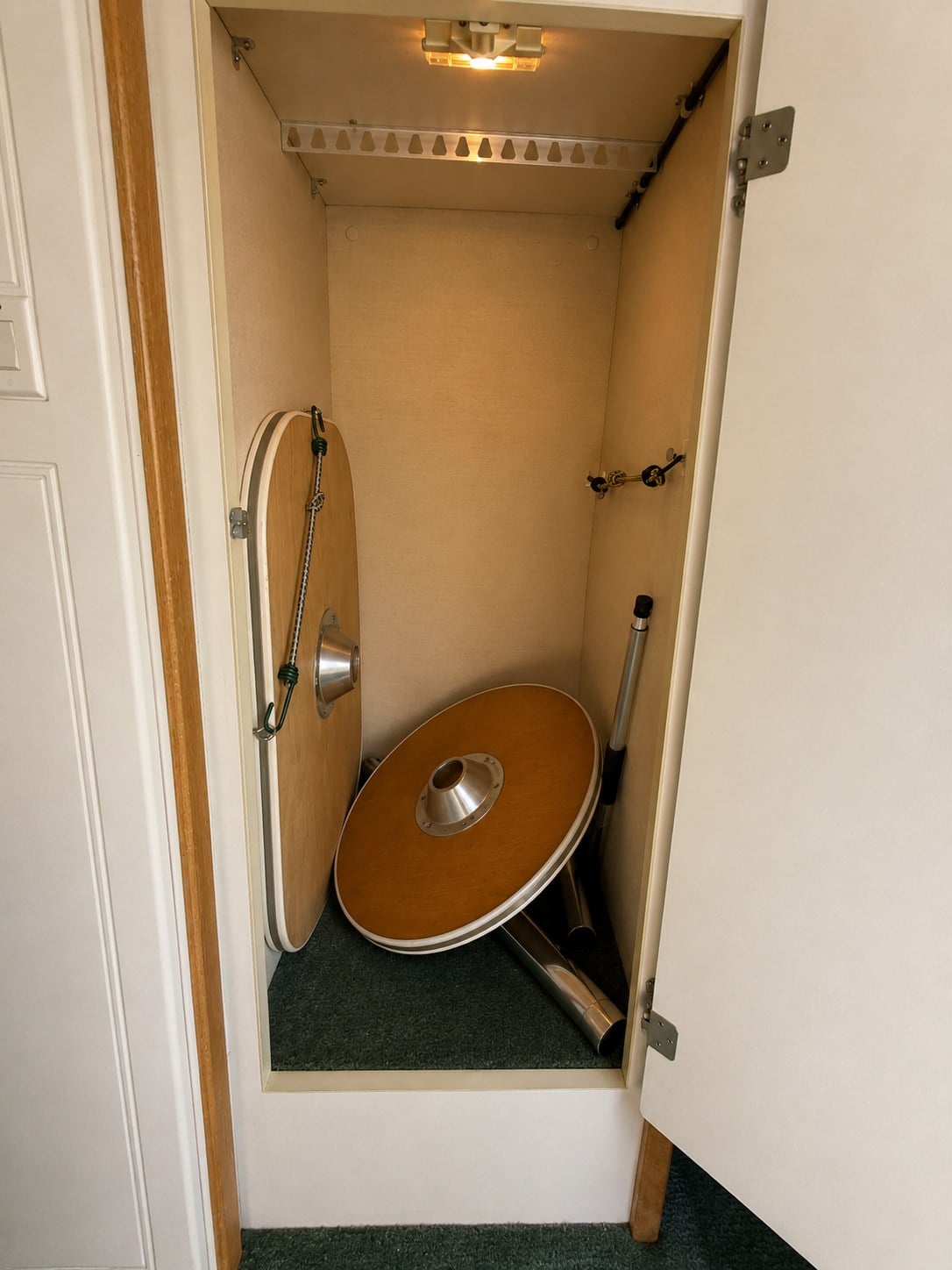 featuring a comfortable bed for your next camper van adventure.|Explore this bright RV rental interior featuring a compact kitchen — photo 11