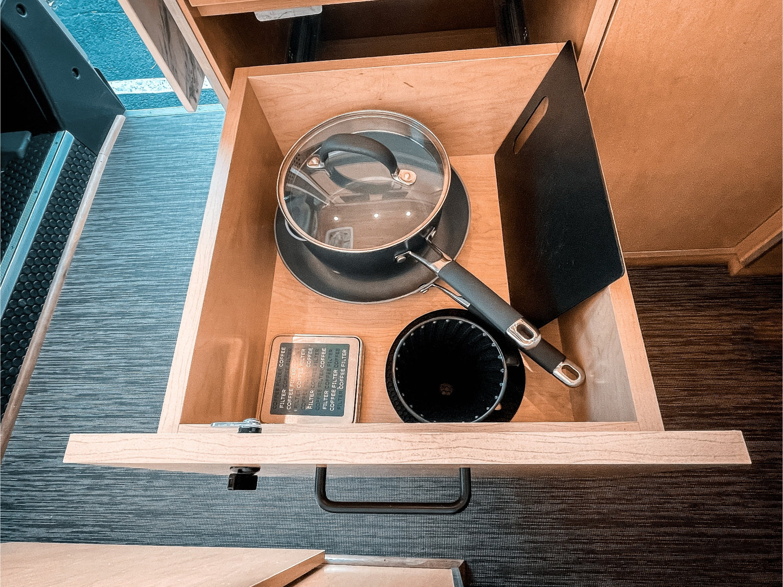 and warm wood accents create a perfect mobile retreat.|Modern RV rental interior with wood details