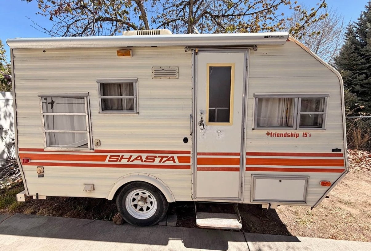 This cream-colored vintage Shasta travel trailer — photo 1